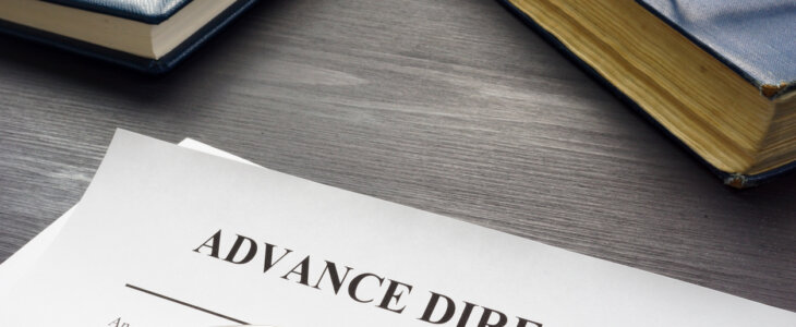 Medical Advance directive form and book with glasses.