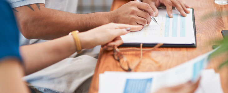 Couple, hands and sign of document, table and legal in office, life cover or insurance with pen. Paperwork, people and agreement of contract, glasses and together for marriage, love and retirement
