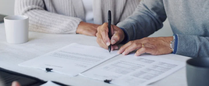 estate planning documents being signed by clients