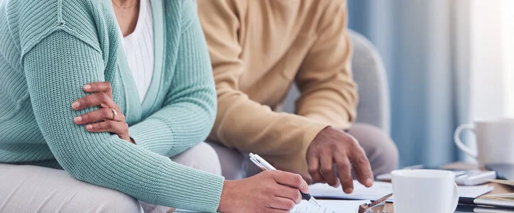 senior couple reviews documents